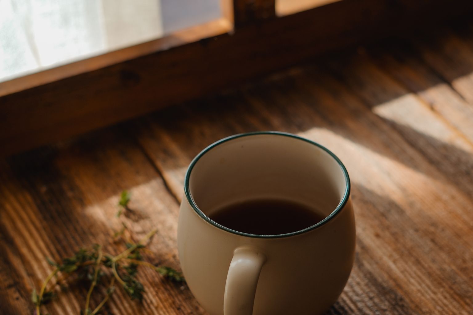 morning coffee in sunlight, the best time for caffeine if you want to increase deep sleep